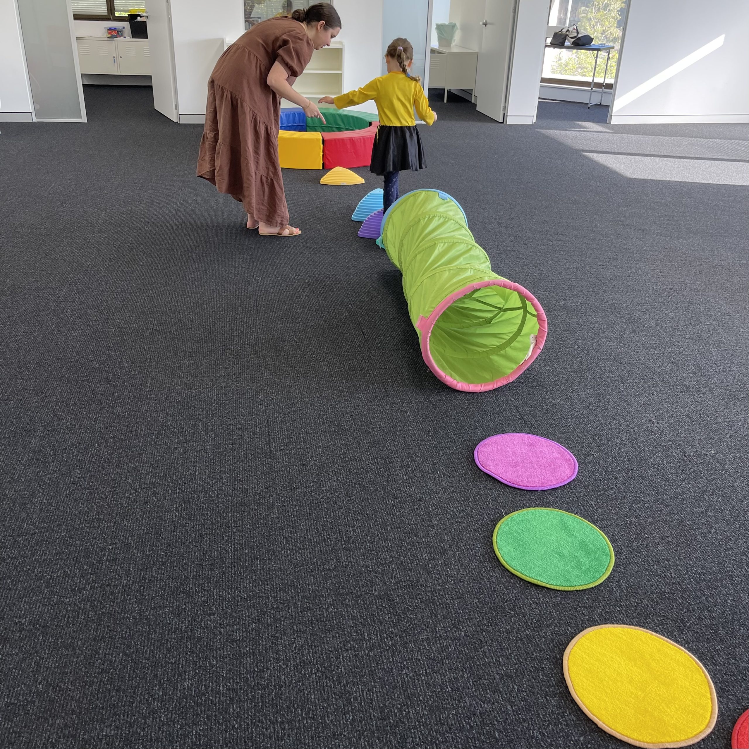 Young girl doing balance and co-ordination activities with occupational therapist in bondi junction and mascot occupational therapy clinic