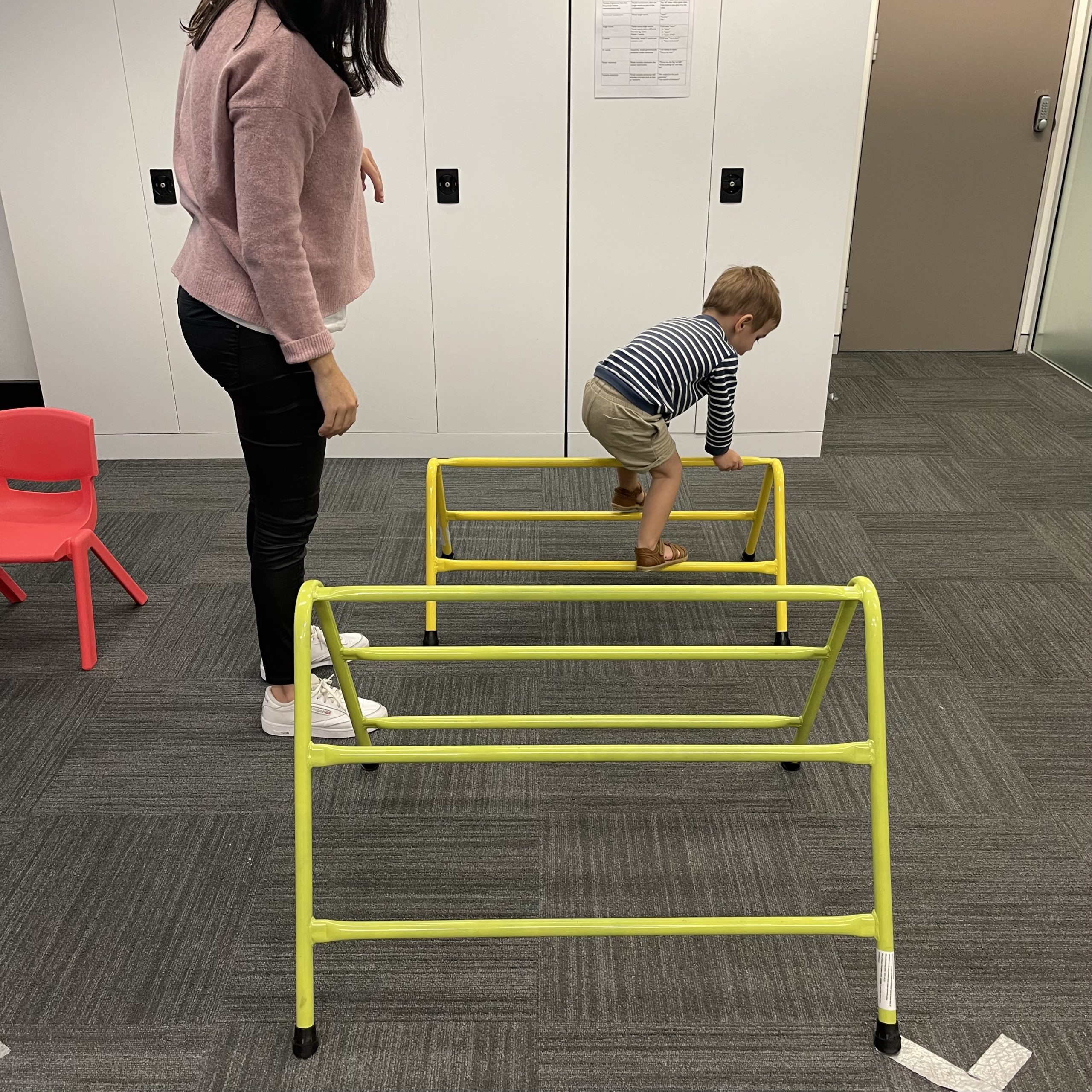 Child with Developmental Delay or Global Developmental Delay climbing in an Occupational Therapy session with an Occupational Therapist in Bondi Junction and Mascot in Sydney