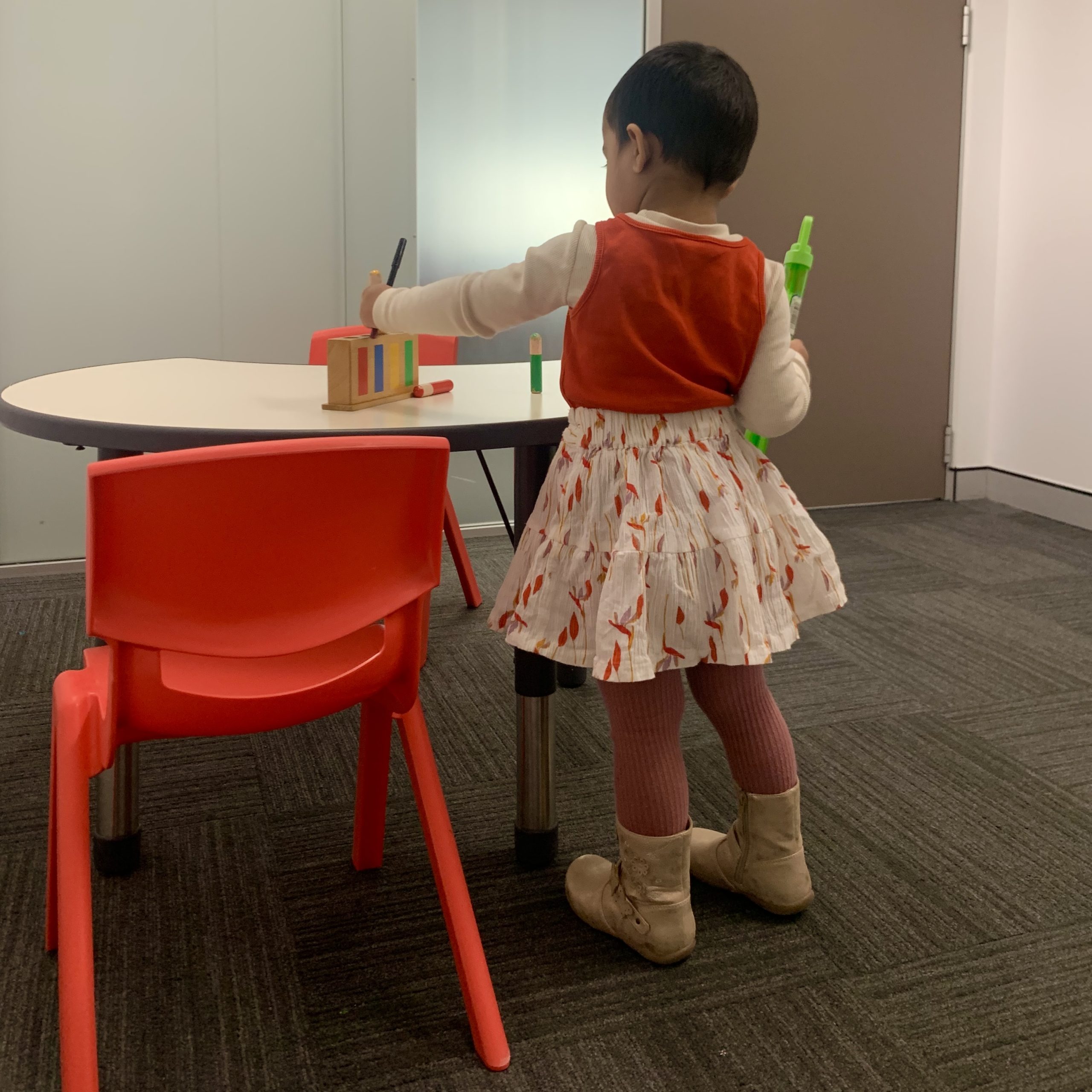 A young girl who was diagnosed early with autism doing an Early Start Denver Model ESDM session with a certified ESDM Therapist in Bondi Junction and Mascot In Sydney