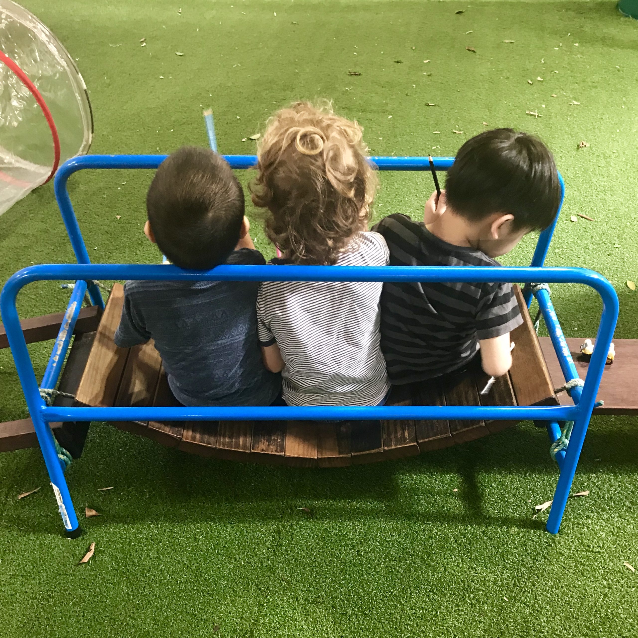 group of children engaged in playful learning activities at daycare, highlighting inclusive environments that support development for children with communication delays needing speech pathologist