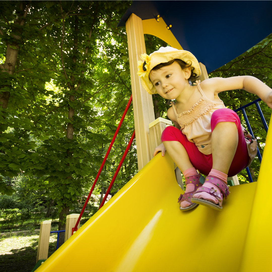 Child with low muscle tone going down a slide doing Occupational Therapy with Occupational Therapist in Bondi Junction or Mascot