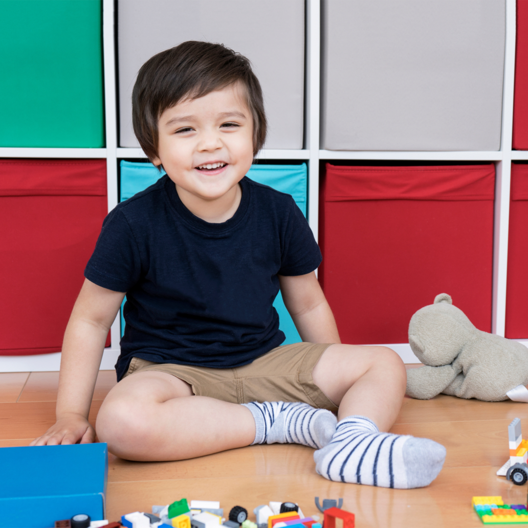 Young boy learning to get dressed with Occupational Therapist in Occupational Therapy clinic in Bondi Junction an dMascot