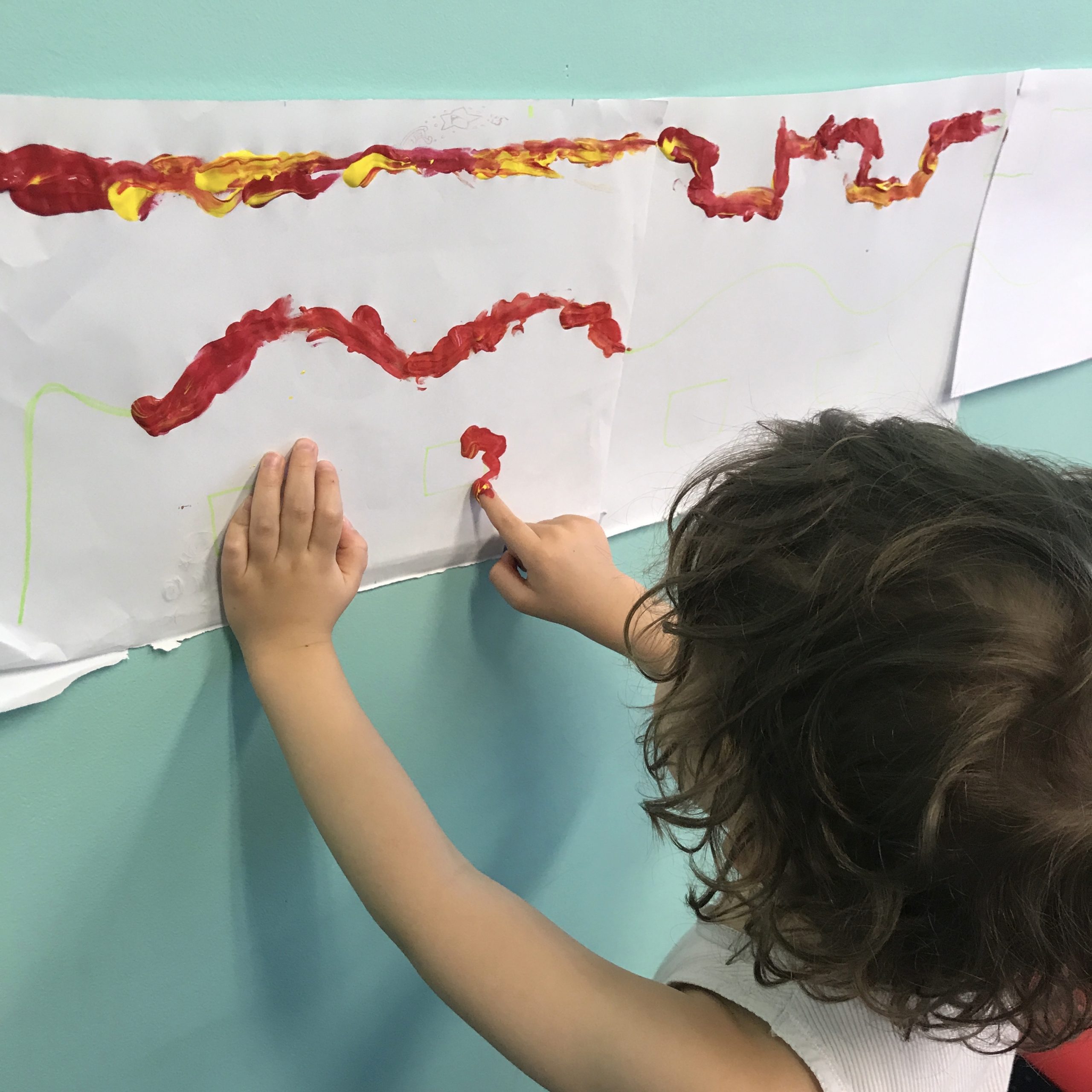 Young boy doing fine motor skills in Early STart Denver Model ESDM clinic with Occupational Therapist in Bondi Junction or Mascot.