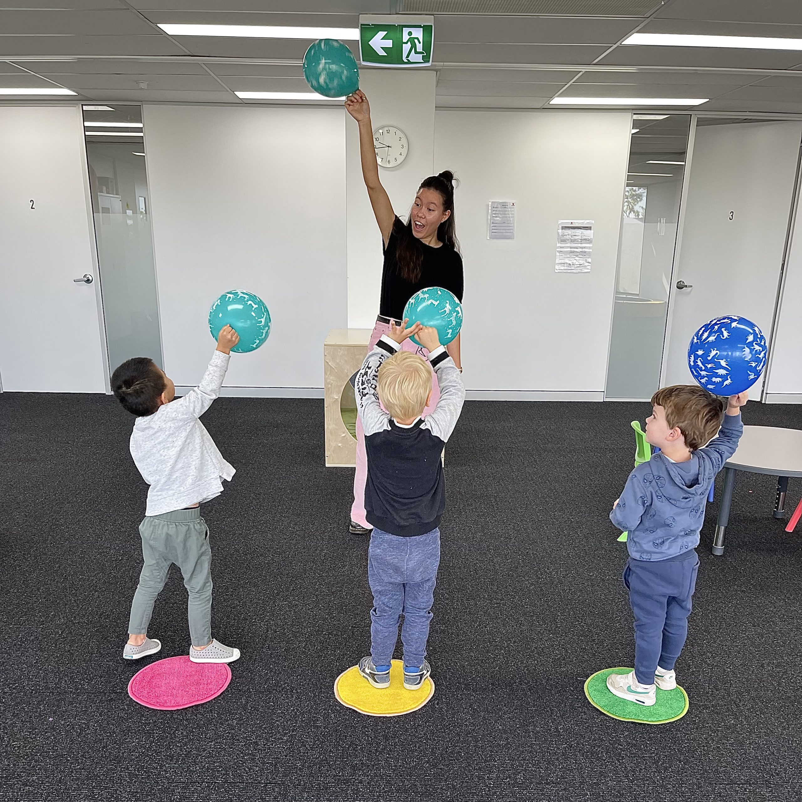 Group of children with autism doing the Early Start Denver Model ESDM early intervention in a clinic in Mascot Sydney with a certified ESDM therapist